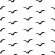 Seamless pattern with black birds on a white background