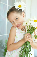 Wall Mural - little girl with dasies flowers
