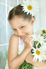Wall Mural - little girl with dasies flowers