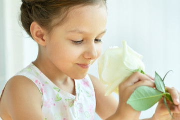 Wall Mural - little girl with rose flower