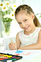 Wall Mural - little girl drawing at home