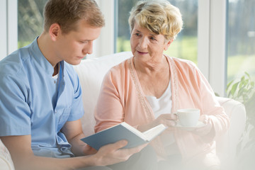 Wall Mural - Older woman spending time with young man