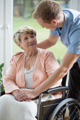 Canvas Print - Male nurse and older woman