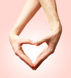© Africa Studio - Hands in shape of heart on light background