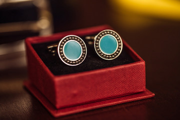 Silver cufflinks closeup in a box.