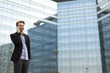 © BGStock72 - Young man on the street with mobile phone