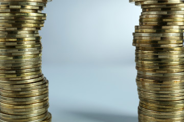 Poster - Pile of coins on light background