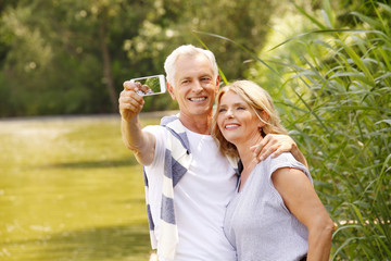 Canvas Print - Senior couple taking selfie