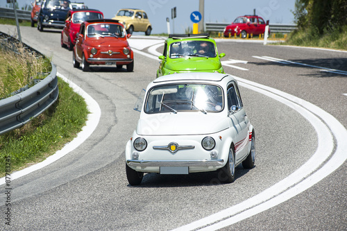 Obraz w ramie A procession of vintage cars