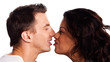 Portrait of a mixed racial couple rubbing noses on a white backg