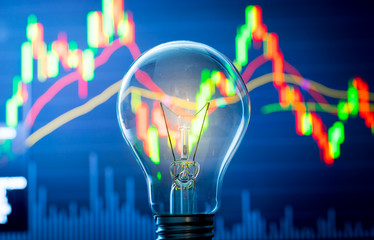 business success with stock graph and light bulb
