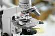 © Africa Studio - Scientific microscope lens close-up in laboratory