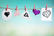© Africa Studio - Hearts hanging on rope on bright background