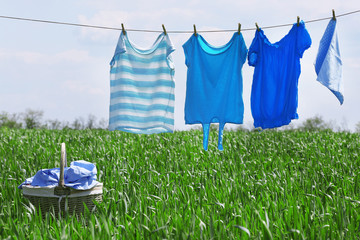 Laundry line with clothes in spring field