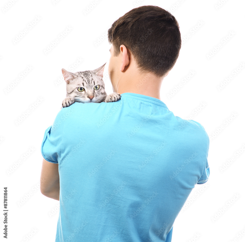 Handsome young man with cute cat isolated on white