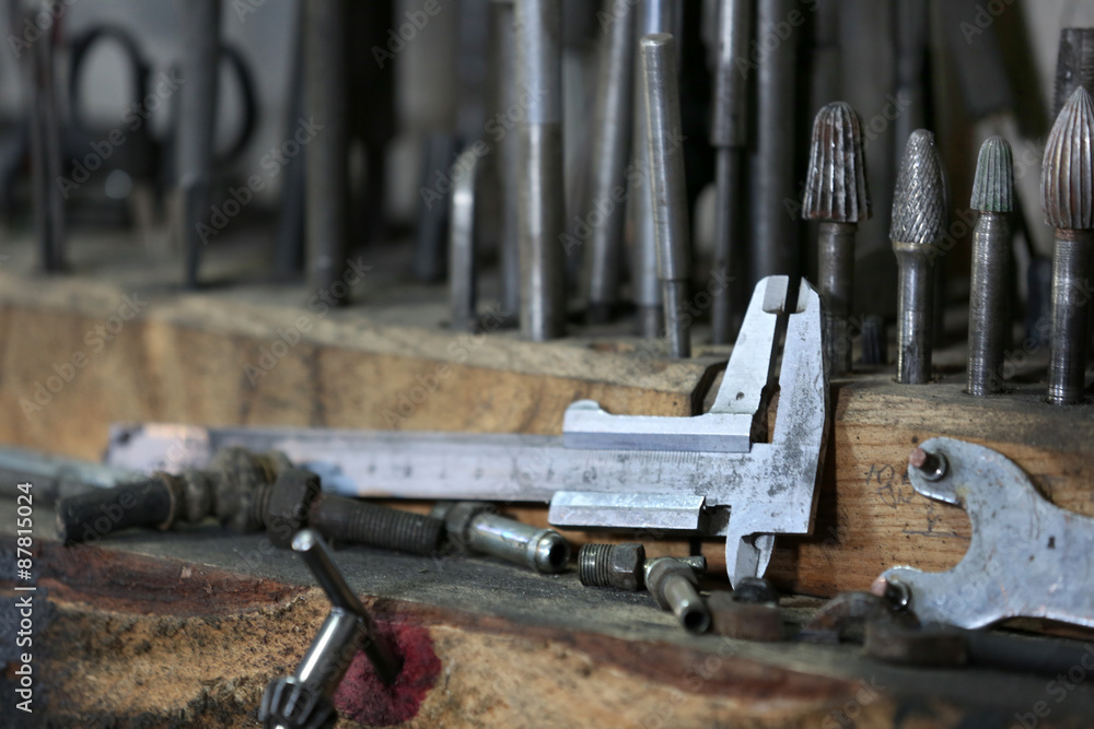 Different tools on workplace in garage