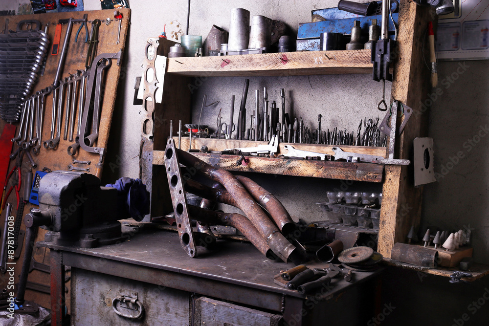 Different tools on workplace in garage