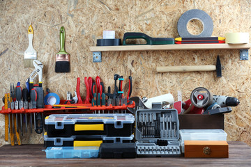 Wall Mural - Set of tools in workshop on plywood background