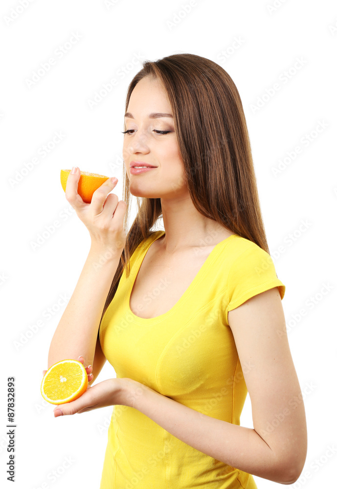 Healthy young woman with sliced orange isolated on white