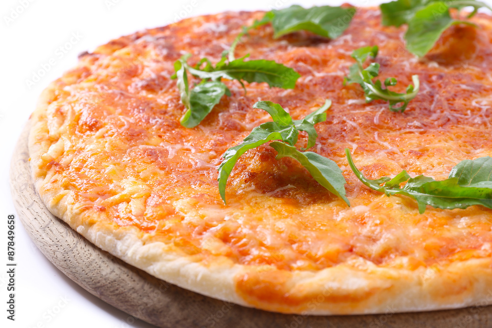 Cheese pizza with herbs on wooden cutting board, closeup