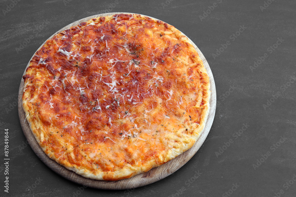 Cheese pizza on wooden table, closeup