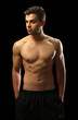 © Africa Studio - Muscle young man on dark background