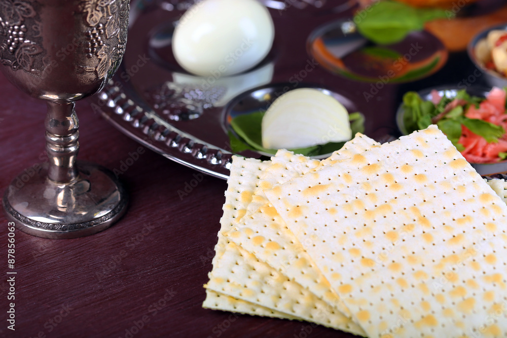 Matzo for Passover with Seder meal on plate on table close up