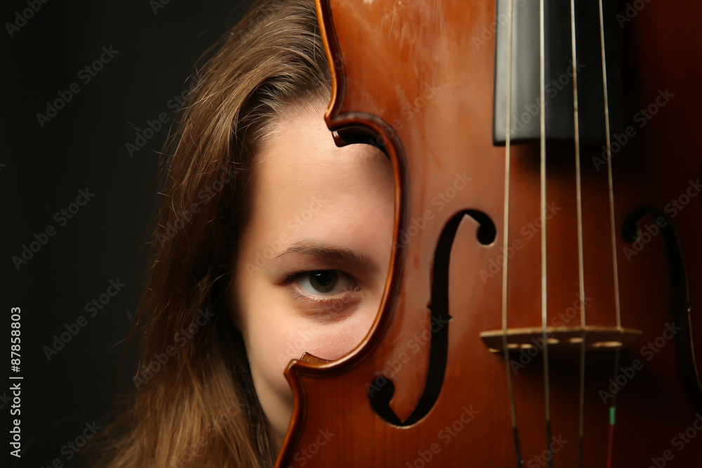 Female portrait with violin, closeup