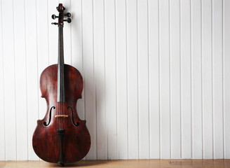 Wall Mural - Cello on wooden planks background