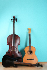 Poster - Musical instruments on turquoise wallpaper background