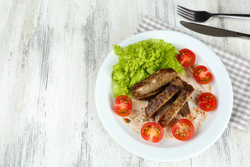 Canvas Print - Tasty slices of meat with sauce and cherry tomato on table close up