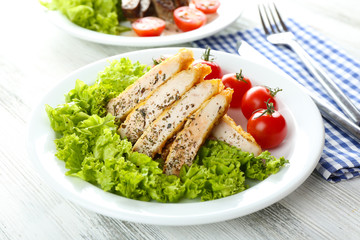 Sticker - Slices of chicken fillet with spices and cherry tomato on table close up