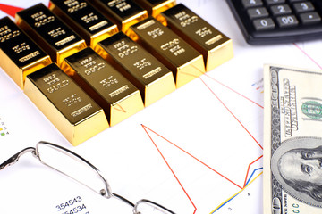 Sticker - Gold bullion with money on table close up