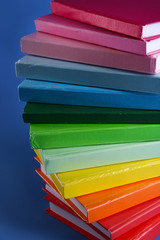 Colorful books on blue background