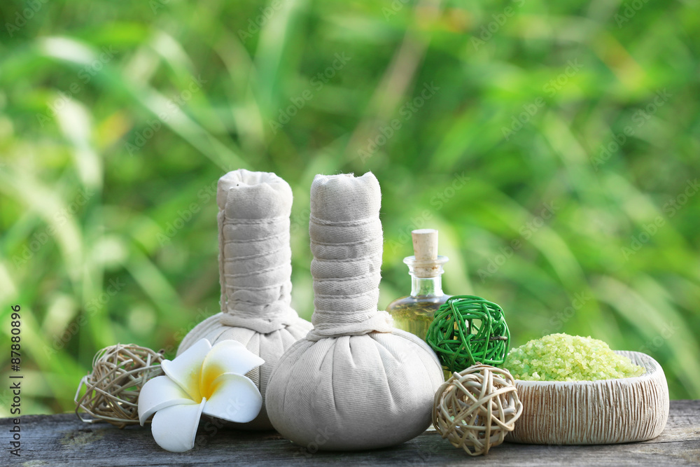 Spa still life on wooden table on river