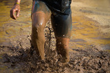 Fototapeta Sport - Mud race runners