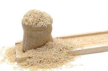 Natural brown rice in small burlap sack