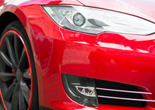 Close-up View Of Red Sports Car Headlight.