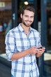 © WavebreakmediaMicro - Hipster man using his smartphone in the city