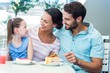 © WavebreakmediaMicro - A family eating at the restaurant