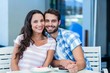 © WavebreakmediaMicro - Young happy couple smiling at the camera
