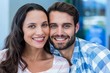© WavebreakmediaMicro - Young happy couple smiling at the camera