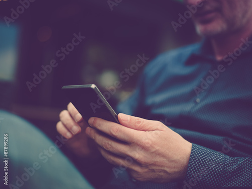 Fotografie, Obraz Close up of a man using mobile smart phone