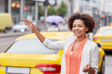 Canvas Print - happy african woman catching taxi