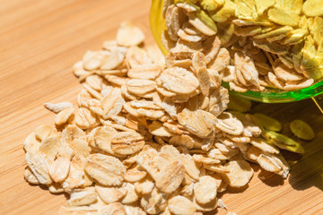 Rolled oats on wooden table