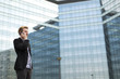 © BGStock72 - Young man on the street with mobile phone