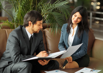 Businessman And Businesswoman Meeting In Modern Office