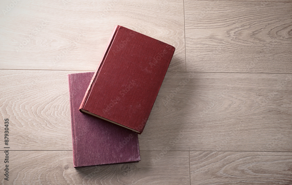 Old books on wooden background