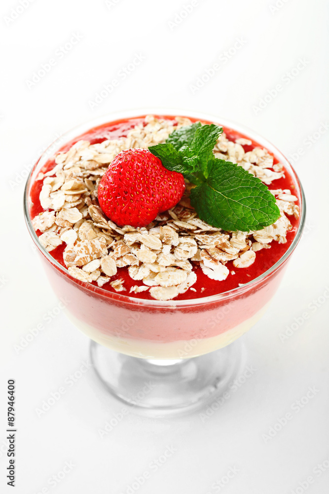 Dessert with fresh strawberry, cream and granola, isolated on white