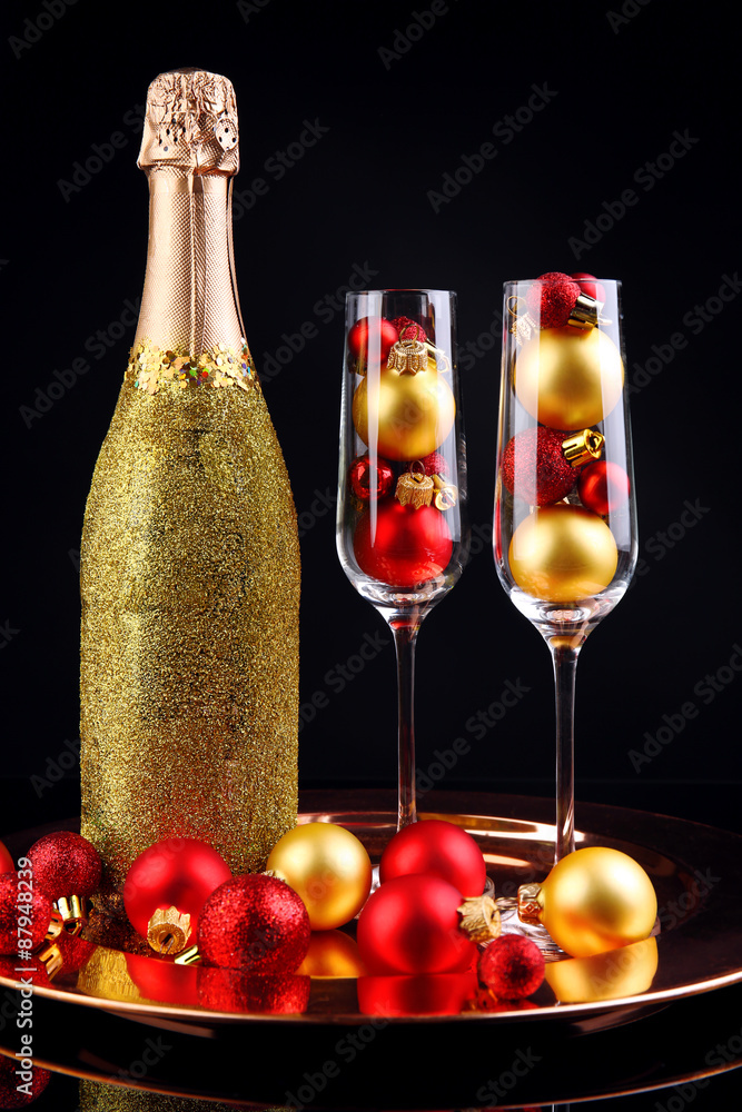 Decorative champagne bottles on dark background